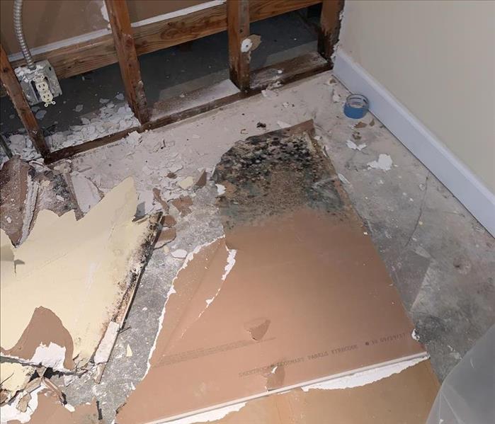 damaged dry wall on the floor after a water intrusion