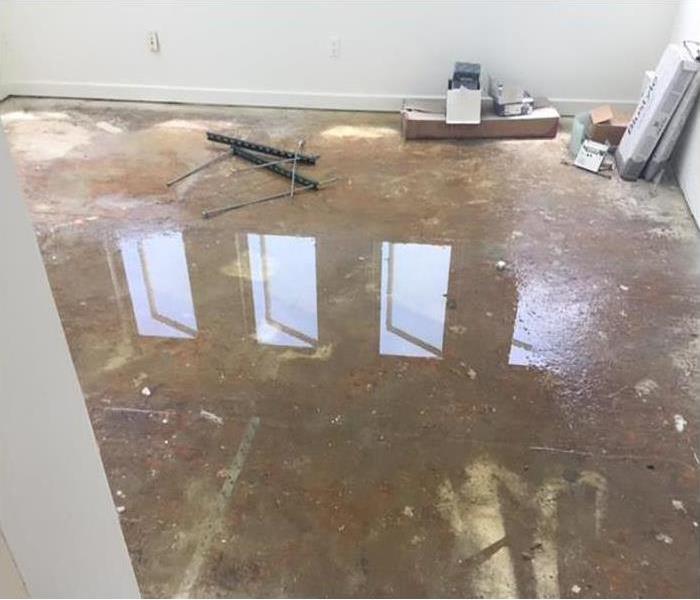 clear water standing in a room, water damage in a room